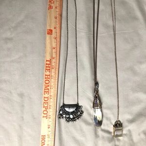 3 long necklaces and one is Chloe